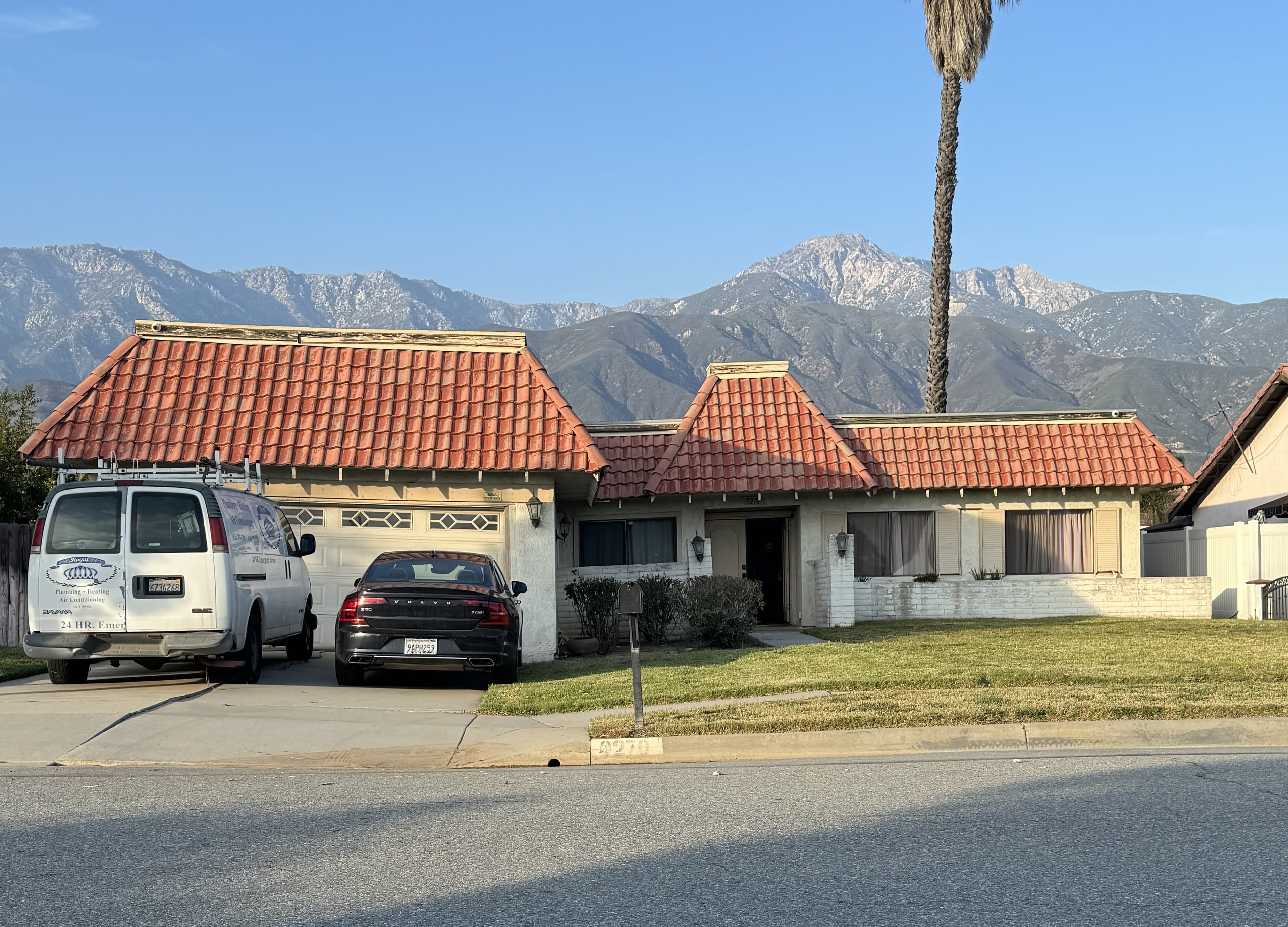 California home with visible foundation cracks and settling in daylight