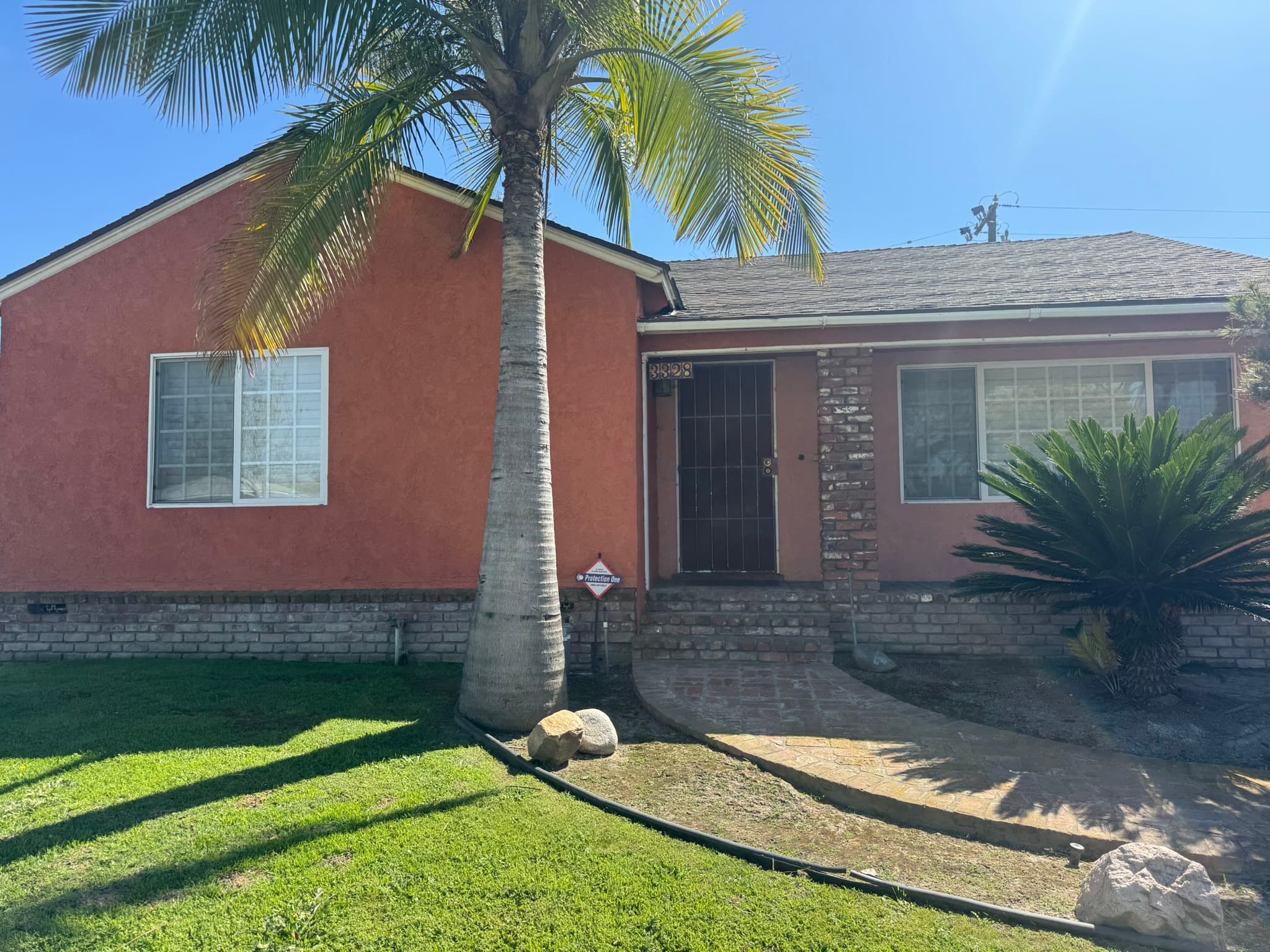 Mid-century California home with original dated exterior styling in daylight